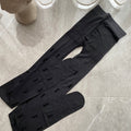 YSL flocked logo haute couture black pantyhose